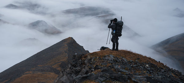 hunter glassing in the mountains