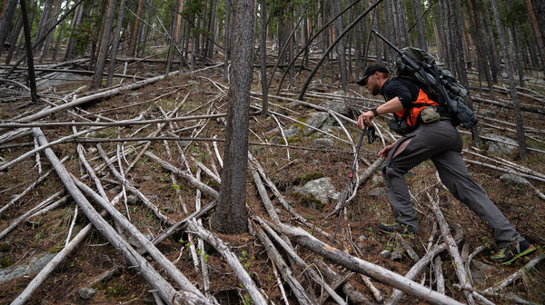 hunter in deadfall with Stone Glacier De Havilland hunting pants