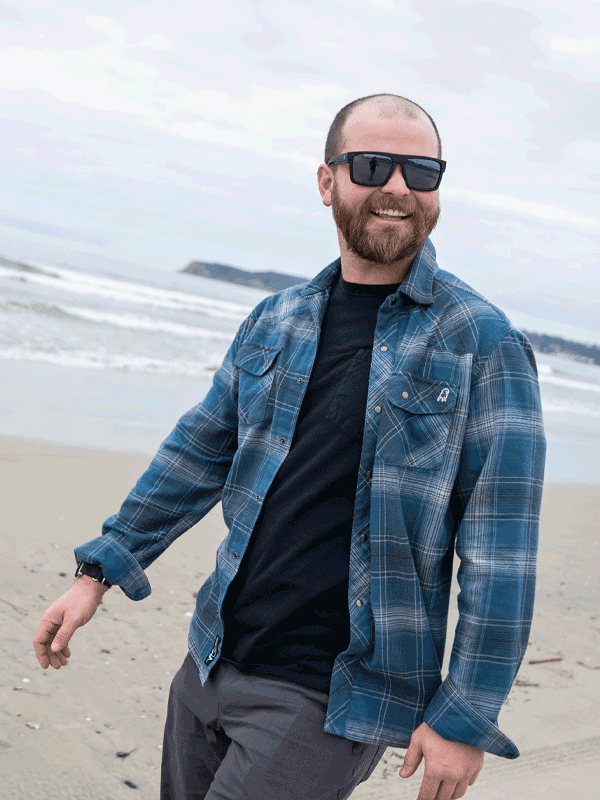 Animated GIF of Logan - a happy man walking on a cloudy beach